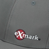 A gray baseball cap with the Exmark logo embroidered on the front left panel.